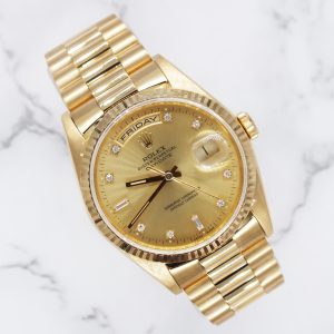 Rolex Day Date with Factory Champagne Diamond Dial - Box and Papers.